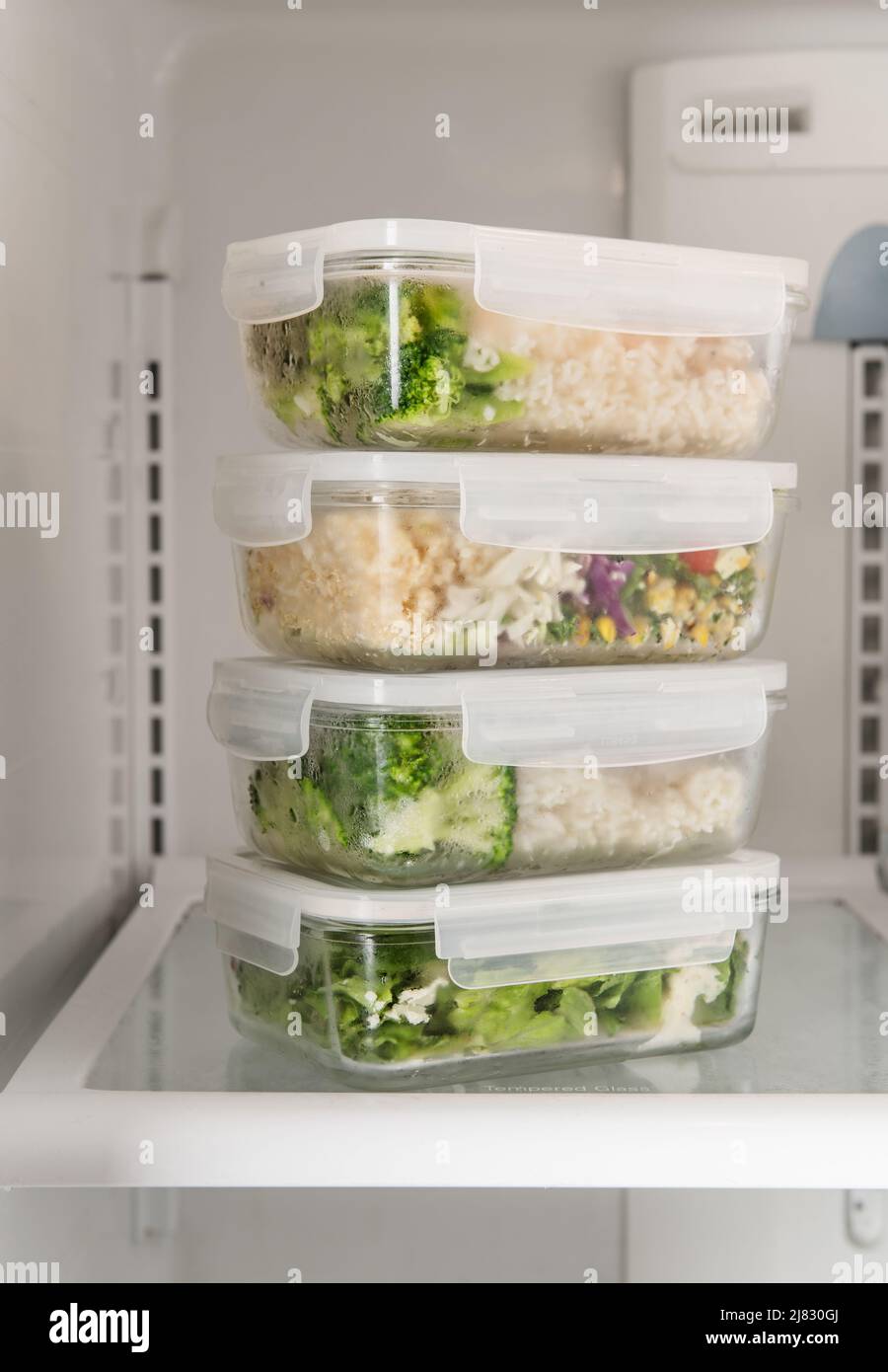 Meals/food prep containers sitting in the fridge Stock Photo