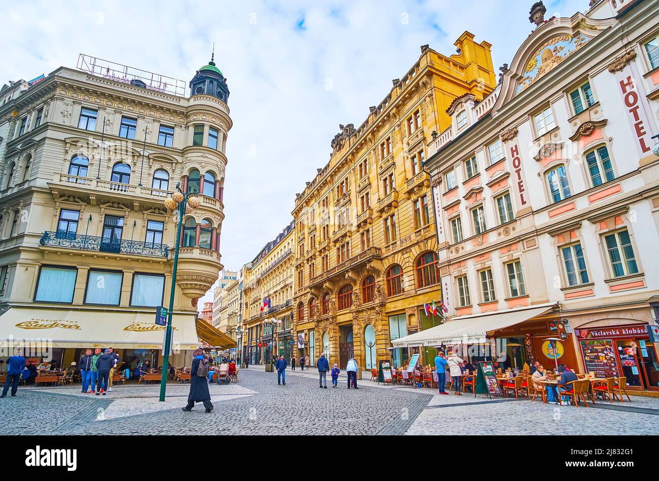 PRAGUE, CZECH REPUBLIC - MARCH 5, 2022: The scenic historic buildings of old Na Prikope (On the Moat) Street with outdoor cafes, hotels and souvenir s Stock Photo