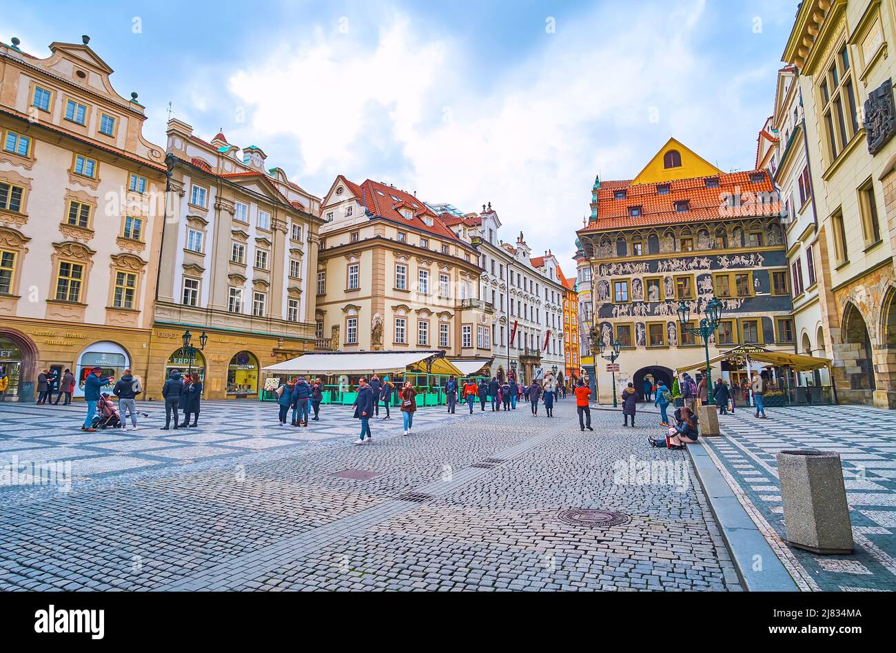 PRAGUE, CZECH REPUBLIC - MARCH 5, 2022: Historic housing of Old Town Square with famous House at the Minute (Dum u Minuty), covered with sgraffito wal Stock Photo