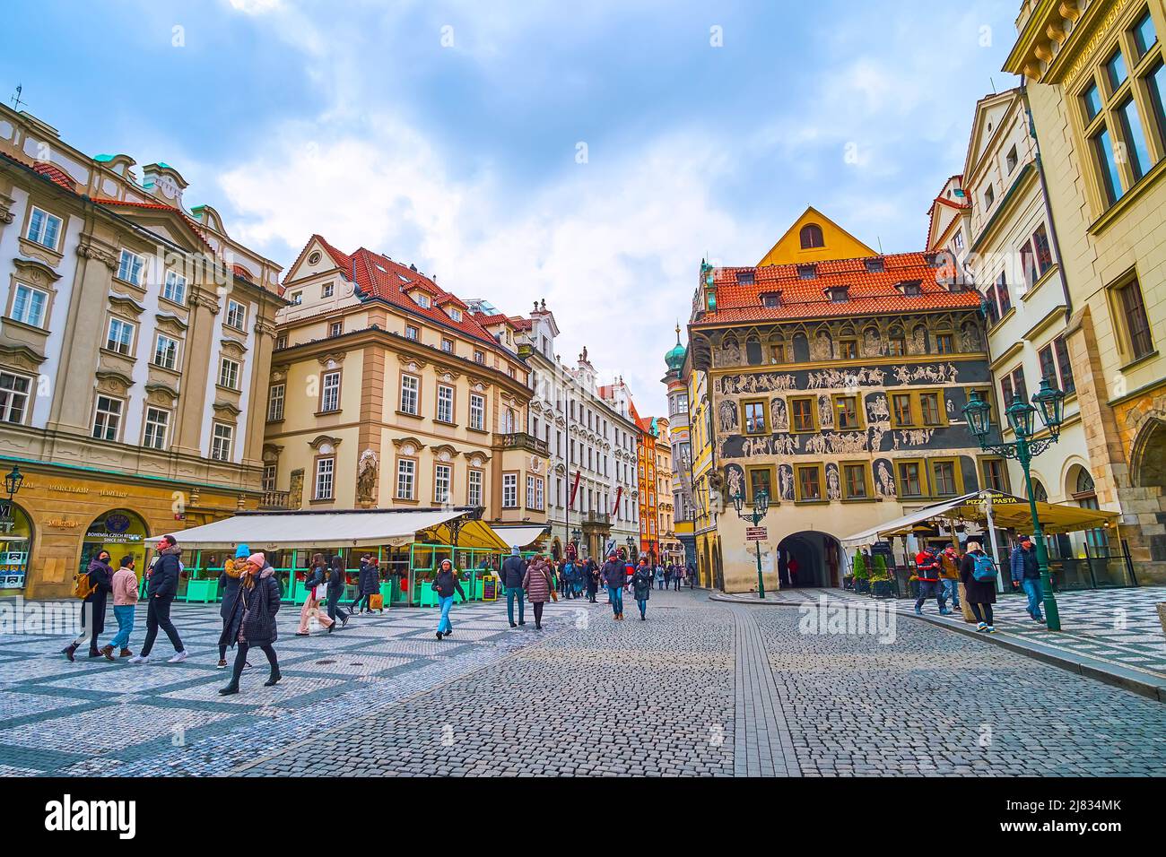 PRAGUE, CZECH REPUBLIC - MARCH 5, 2022: Walk the Old Town Square and enjoy its unique architecture, historic townhouses and sgraffito wall decoration Stock Photo