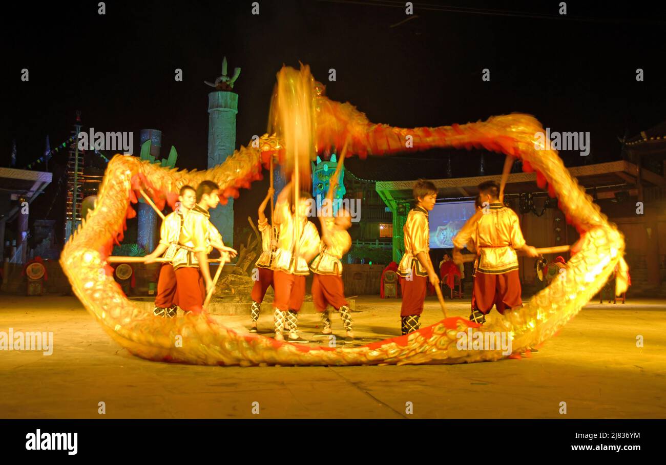 Fenghuang, Hunan Province, China: Dragon dance at a night festival in Fenghuang. The Chinese dragon dance is a traditional cultural performance. Stock Photo