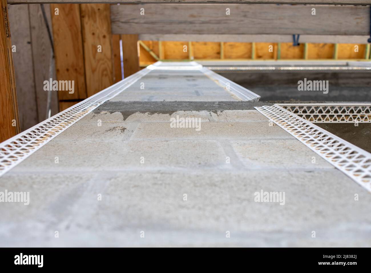 view upwards on a corner wall of a multiplex apartment building with