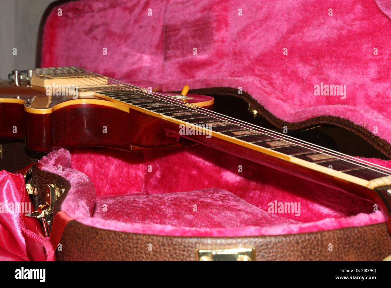 Photo of vintage Les Paul guitar body taken from an angle, showing wear