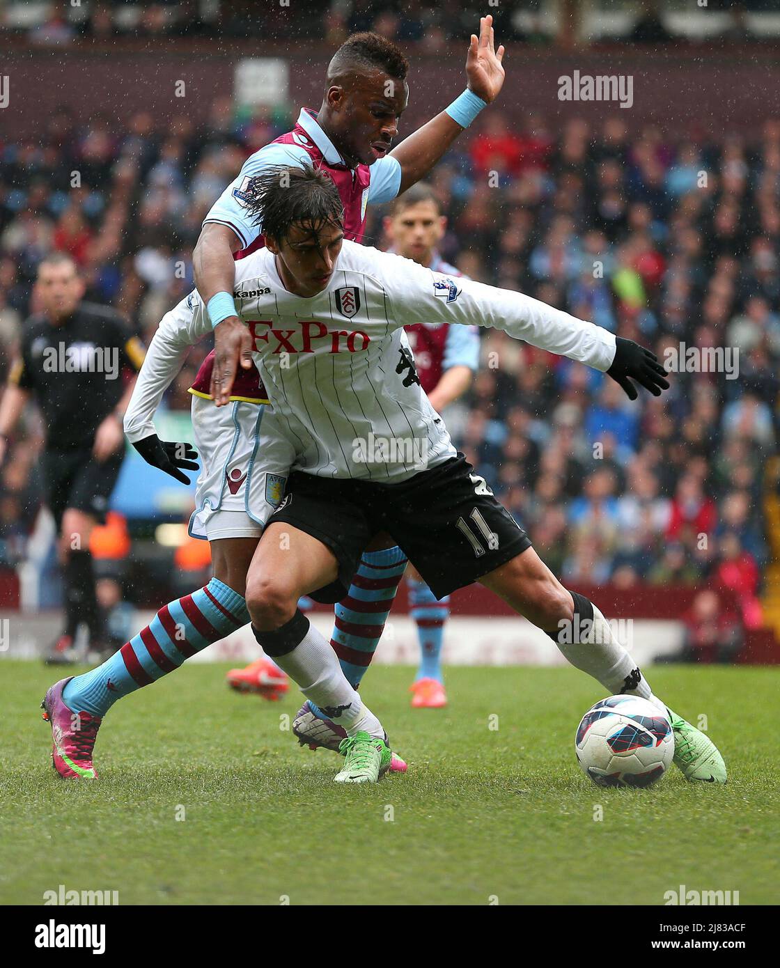 13 April 2013  - Soccer - Barclays Premiership Football - Aston Villa Vs. Fulham -  Yacouba Sylla of Aston Villa challenges Bryan Ruiz of Fulham. - Photo: Paul Roberts / Pathos. Stock Photo
