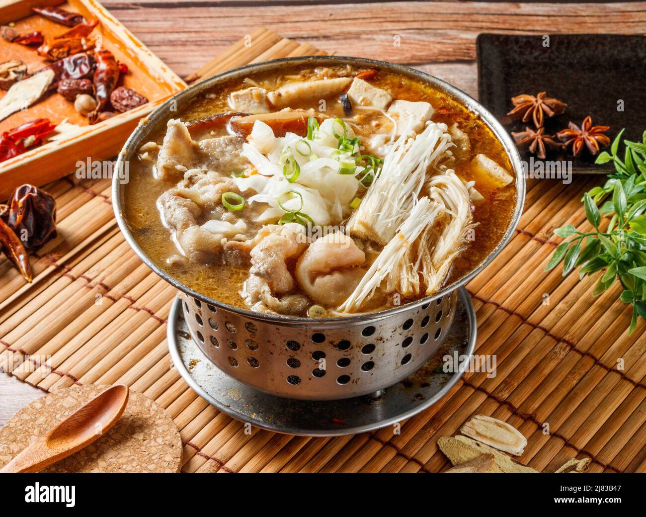 https://c8.alamy.com/comp/2J83B47/stinky-beef-hot-pot-stew-with-red-chili-isolated-on-mat-side-view-of-japanese-food-2J83B47.jpg