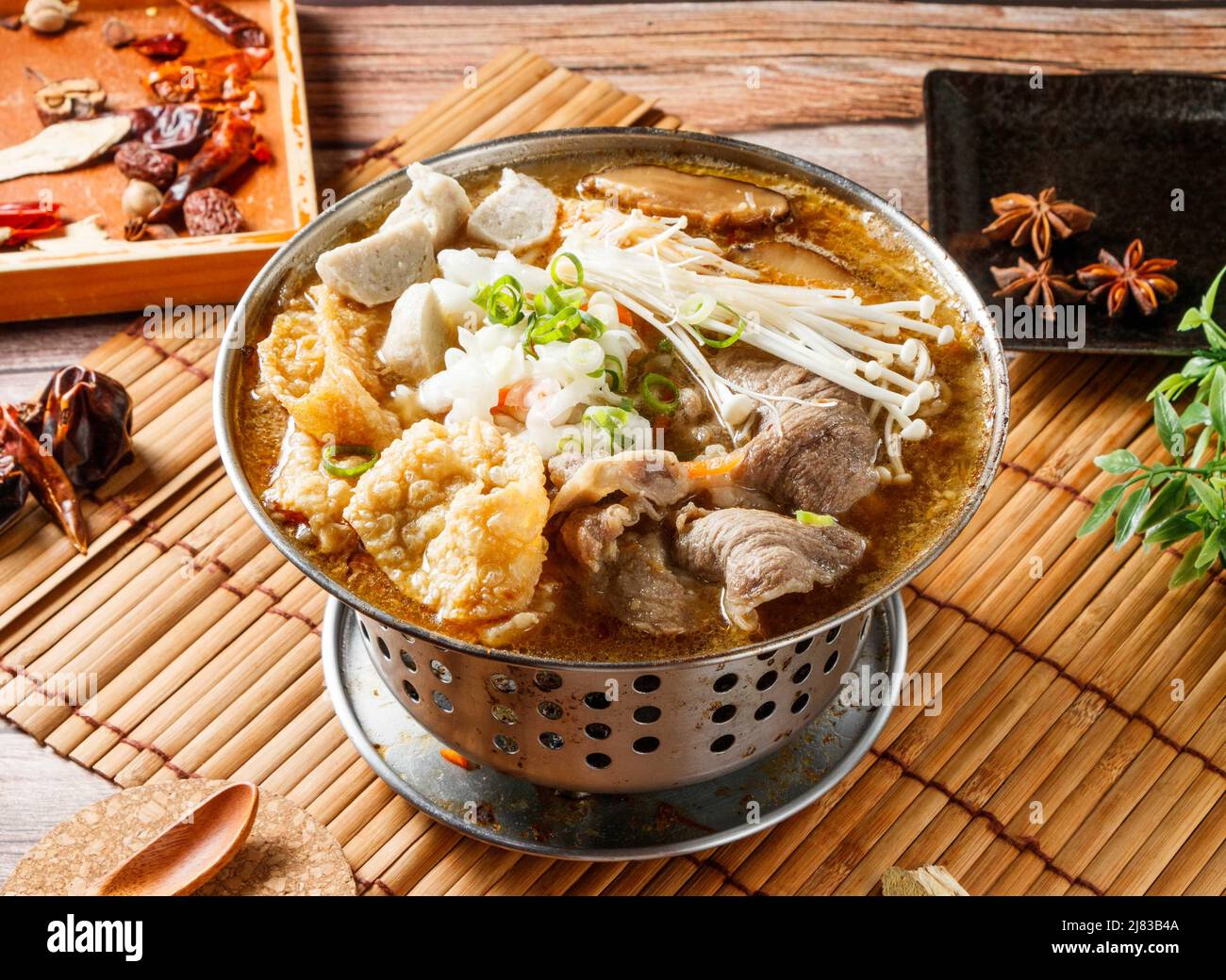Lamb hot pot stew with red chili isolated on mat side view of japanese food Stock Photo