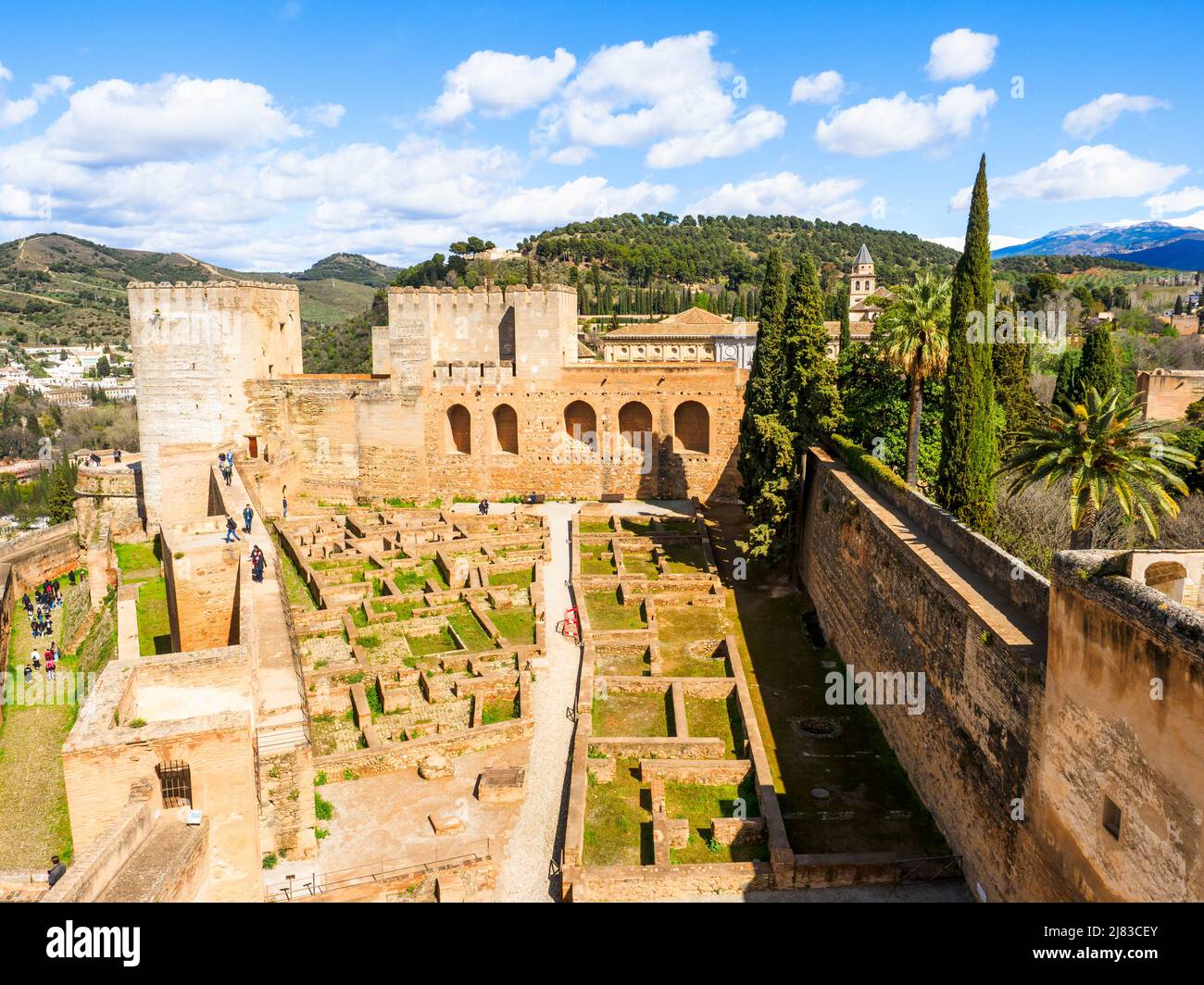 View from the Torre de la Vela, looking east across the Alcazaba's interior. The Torre del Homenaje is on the left, at the back, and the Torre Quebrada is to the right of it - Alhambra complex - Granada, Spain Stock Photo