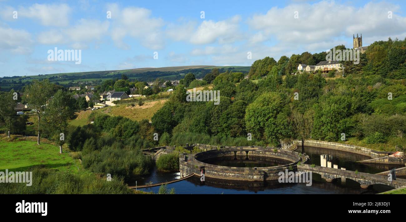 Old Water works and river Etherow at Hadfield Derbyshire with village of Tintwistle in background. Stock Photo