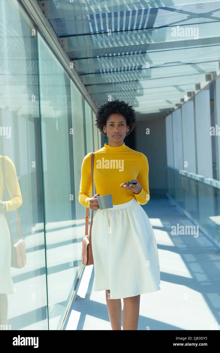 African american businesswoman walking in hi-res stock photography and ...