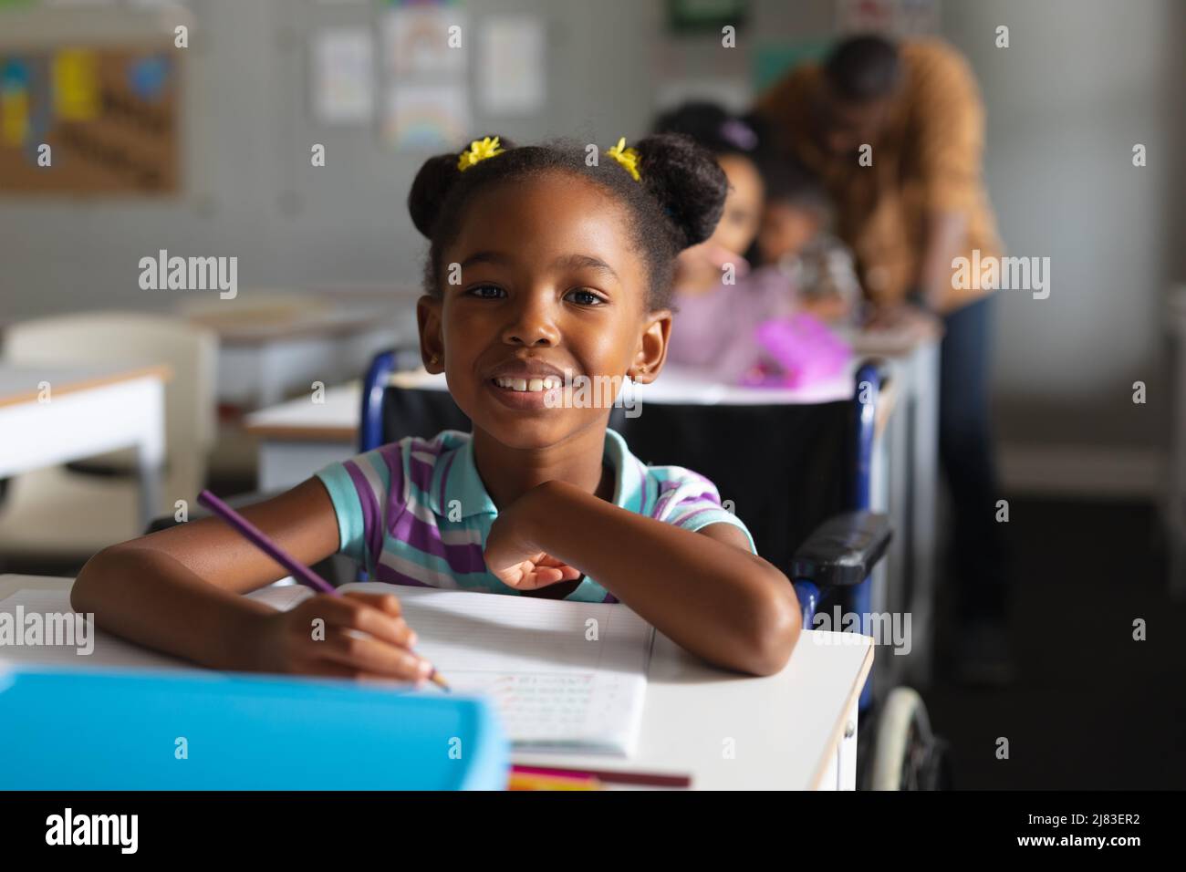 African girl with smiling book hi-res stock photography and images - Alamy