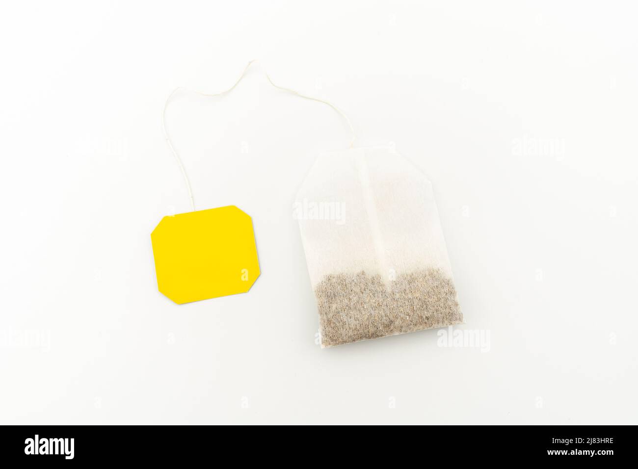 With white background isolated tea bag with blank label. Stock Photo