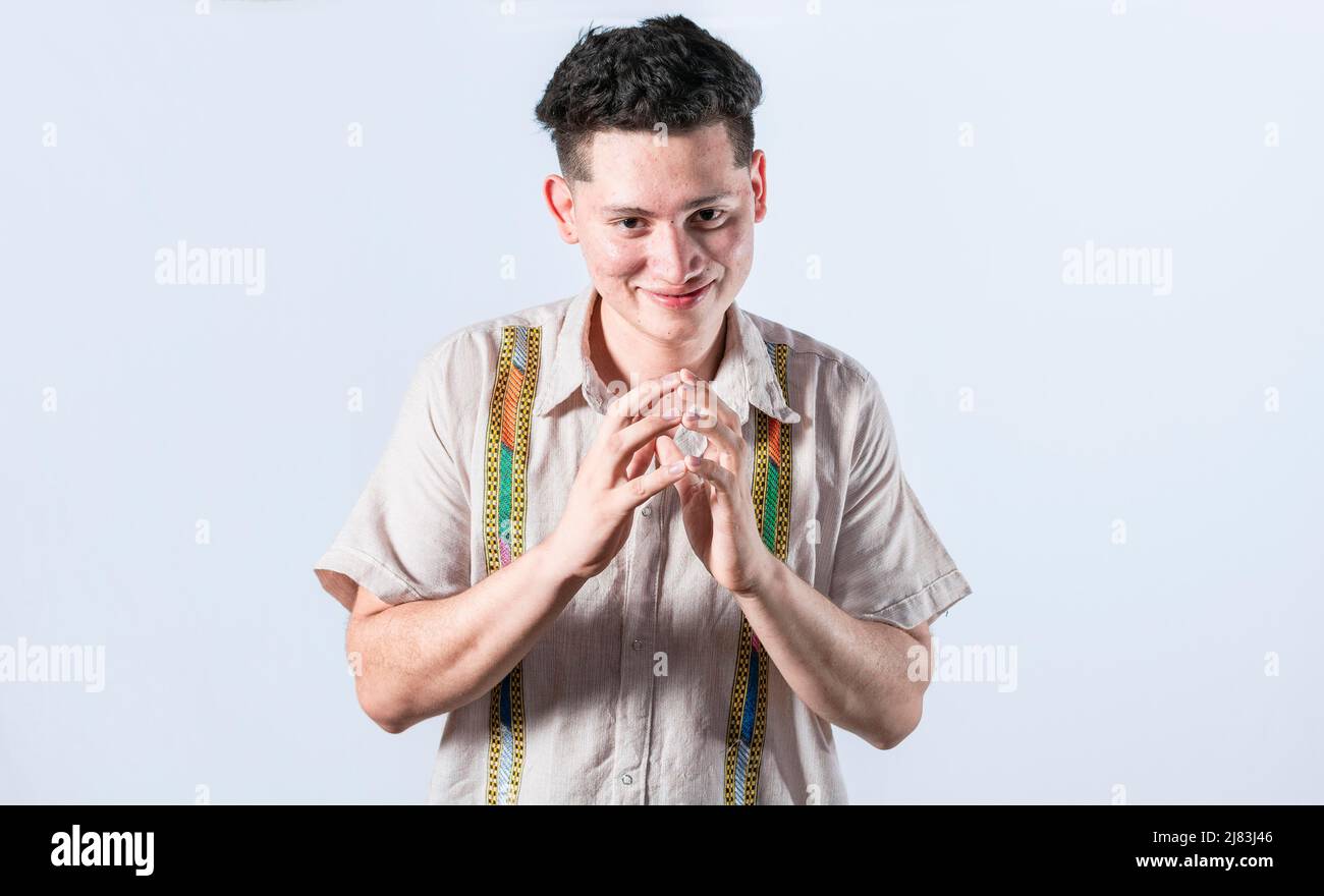 Cunning man rubbing his hands on isolated background, person rubbing his hands planning something, concept of cunning man planning something Stock Photo