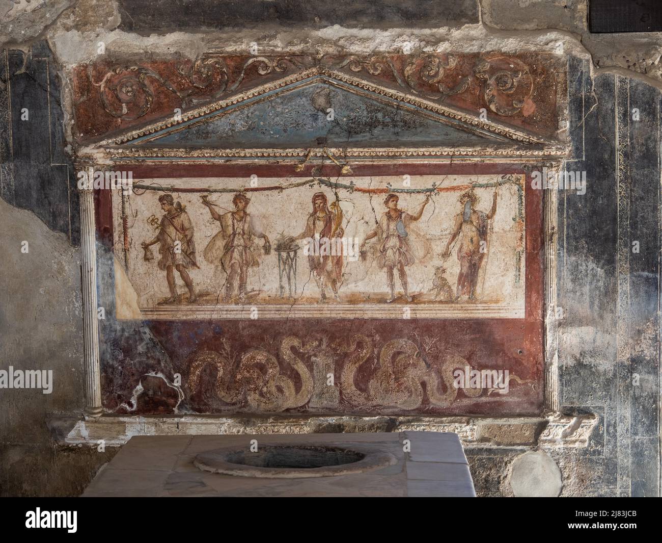 House shrine, lararium in a thermopolium, Pompeii, Campania, Italy Stock Photo