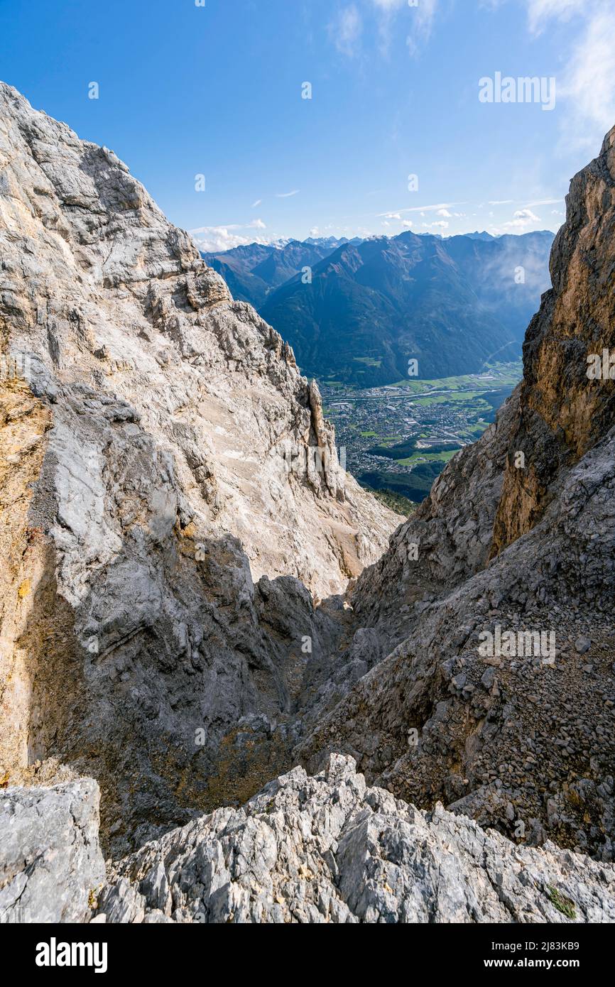 Scharte with view into the Inn valley with the village of Telfs, crossing the Hohe Munde, Mieminger Kette, Tyrol, Austria Stock Photo
