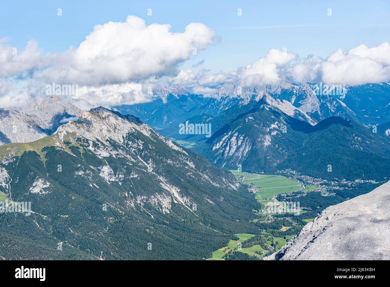 View over mountain valley, Leutasch with Arnspitze, Wetterstein Mountains and Karwendel, view from summit, Hohe Munde, Mieminger Mountains, Tyrol Stock Photo