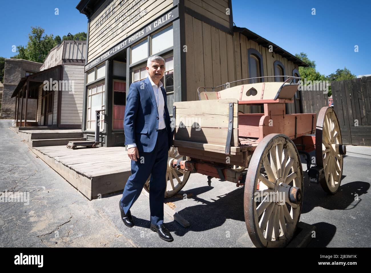 Mayor of London Sadiq Khan on a western film set during a visit to Universal Studios in Los Angeles while on a visit to the US in a bid to boost London's tourism industry. Picture date: Thursday May 12, 2022. Stock Photo