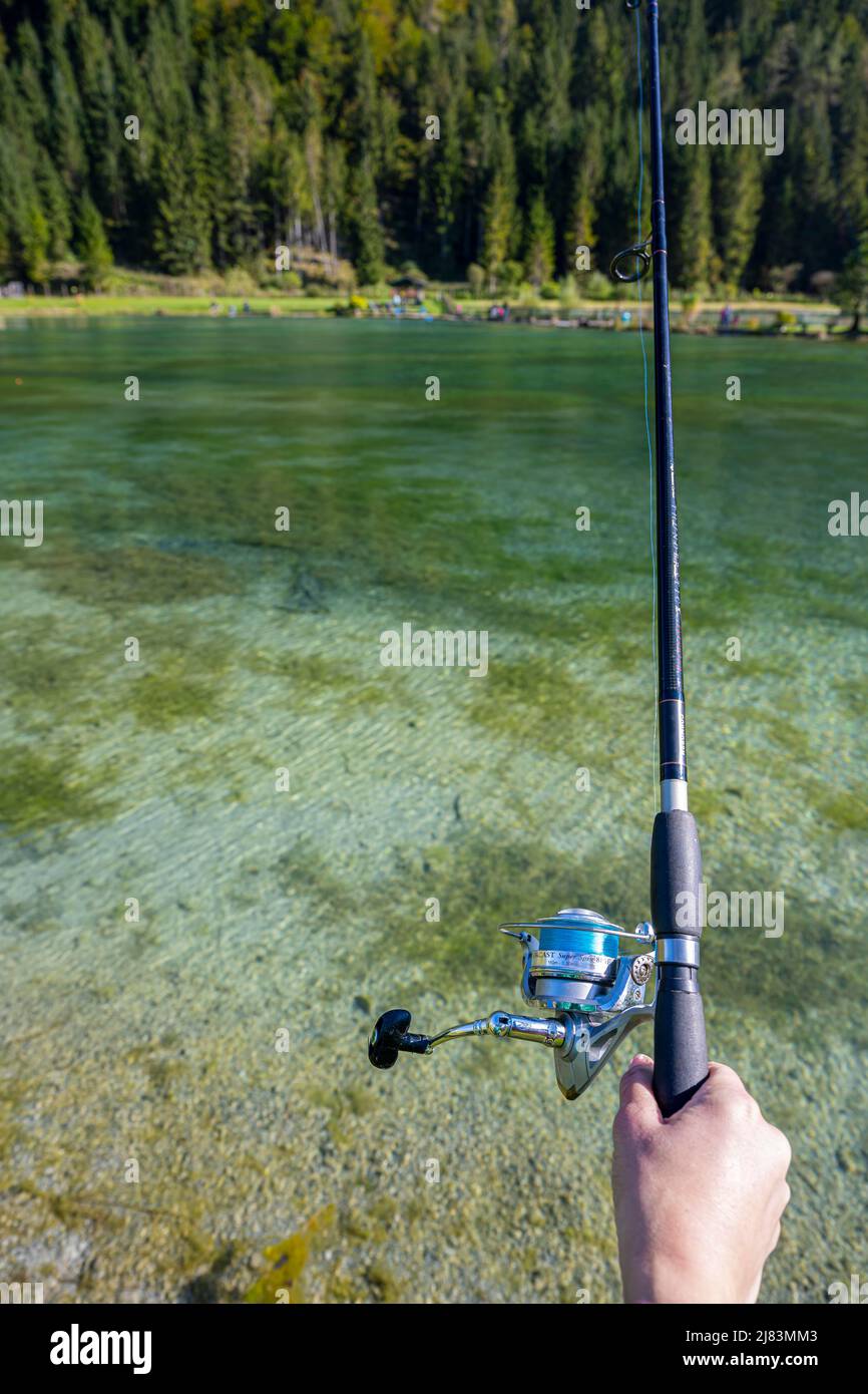 Fishing at a small pond, fishing rod Stock Photo