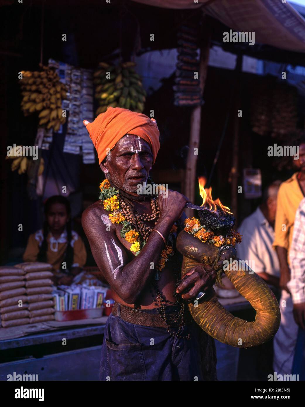 A devotee holding fire torch, discharging vow in Ranganatha temple at