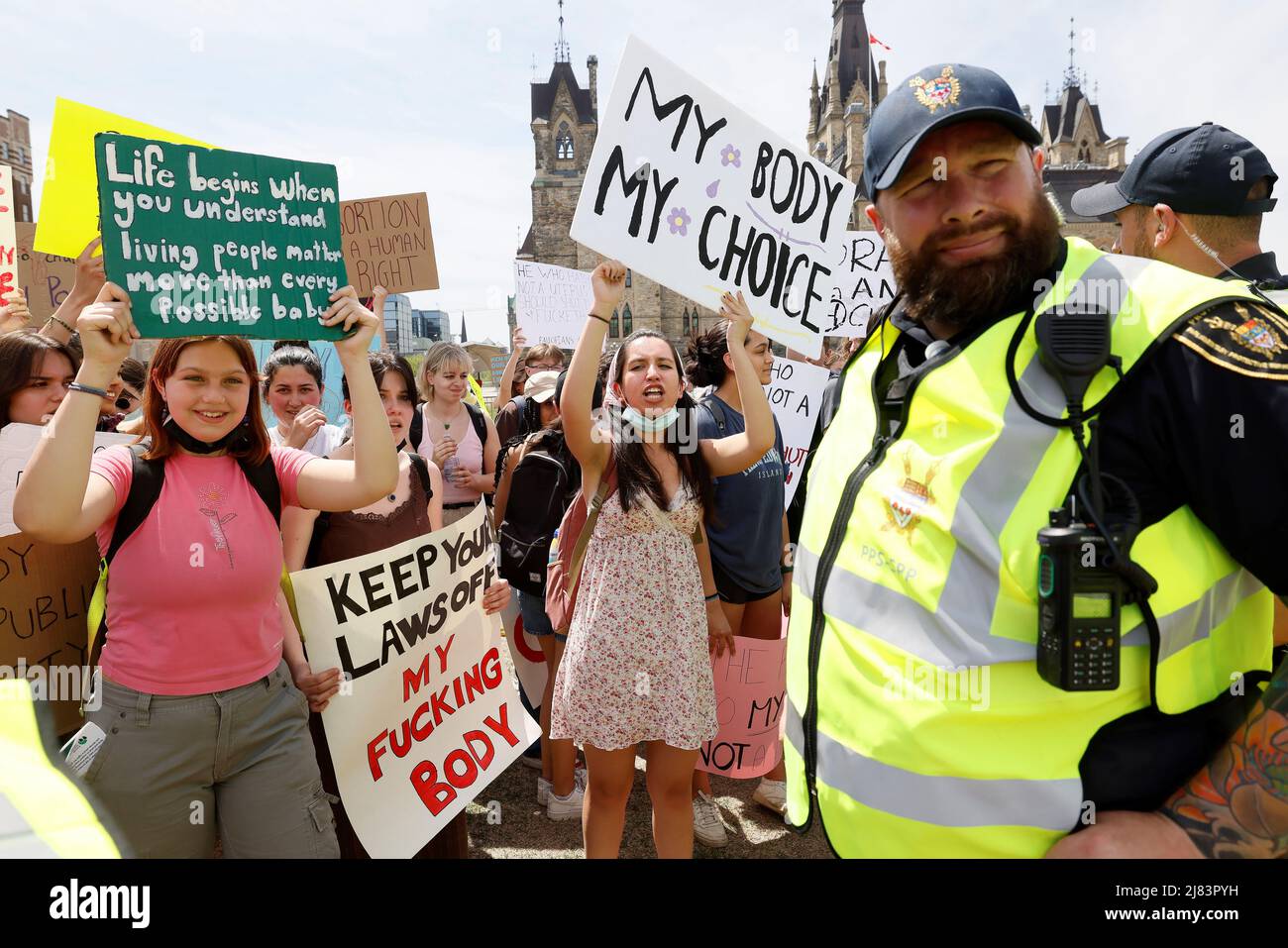 Abortion rights campaigners are separated from an anti-abortion rally by Parliamentary Protective Service members on Parliament Hill in Ottawa, Ontario, Canada May 12, 2022. REUTERS/Blair Gable Stock Photo
