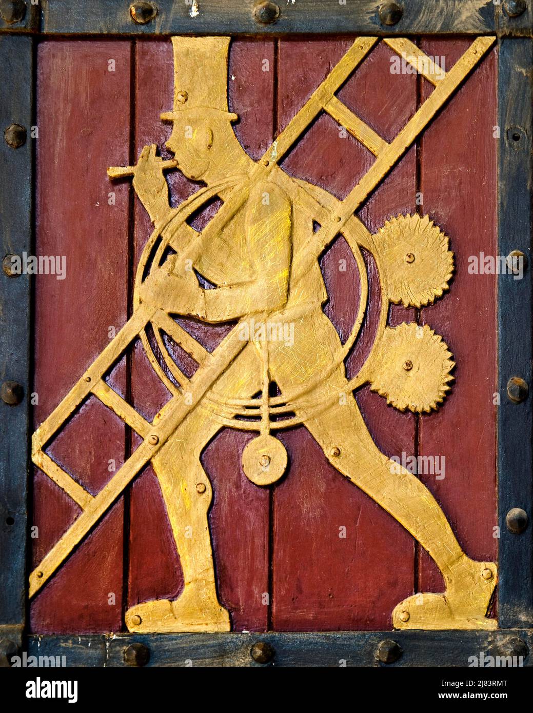 Historic figure on the door to the Ratskeller representing the craft of the chimney sweep, Luebeck, Schleswig-Holstein, Germany Stock Photo