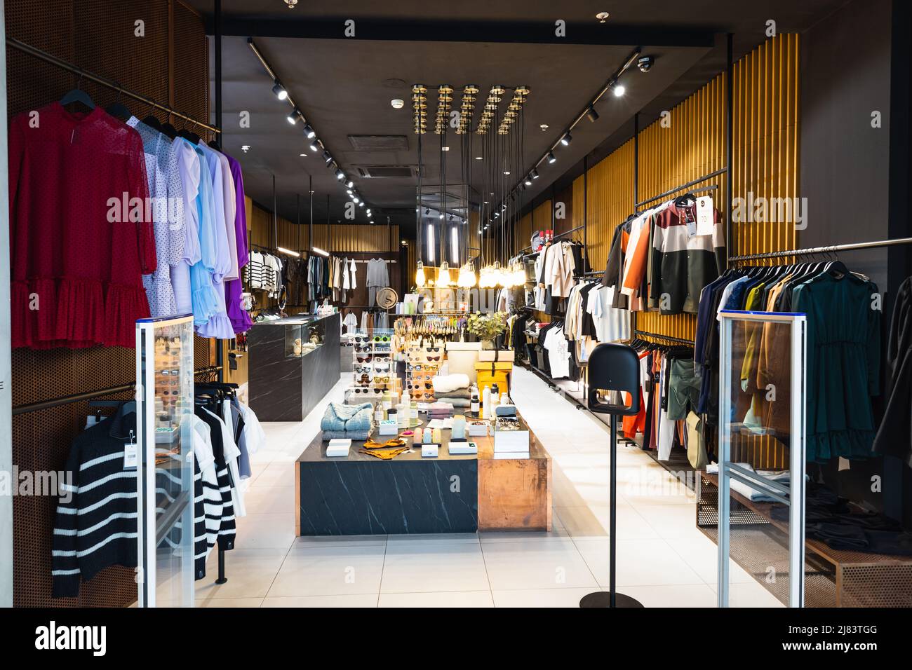 Interior of a brand new fashion clothing store. Panorama, Vilnius ...