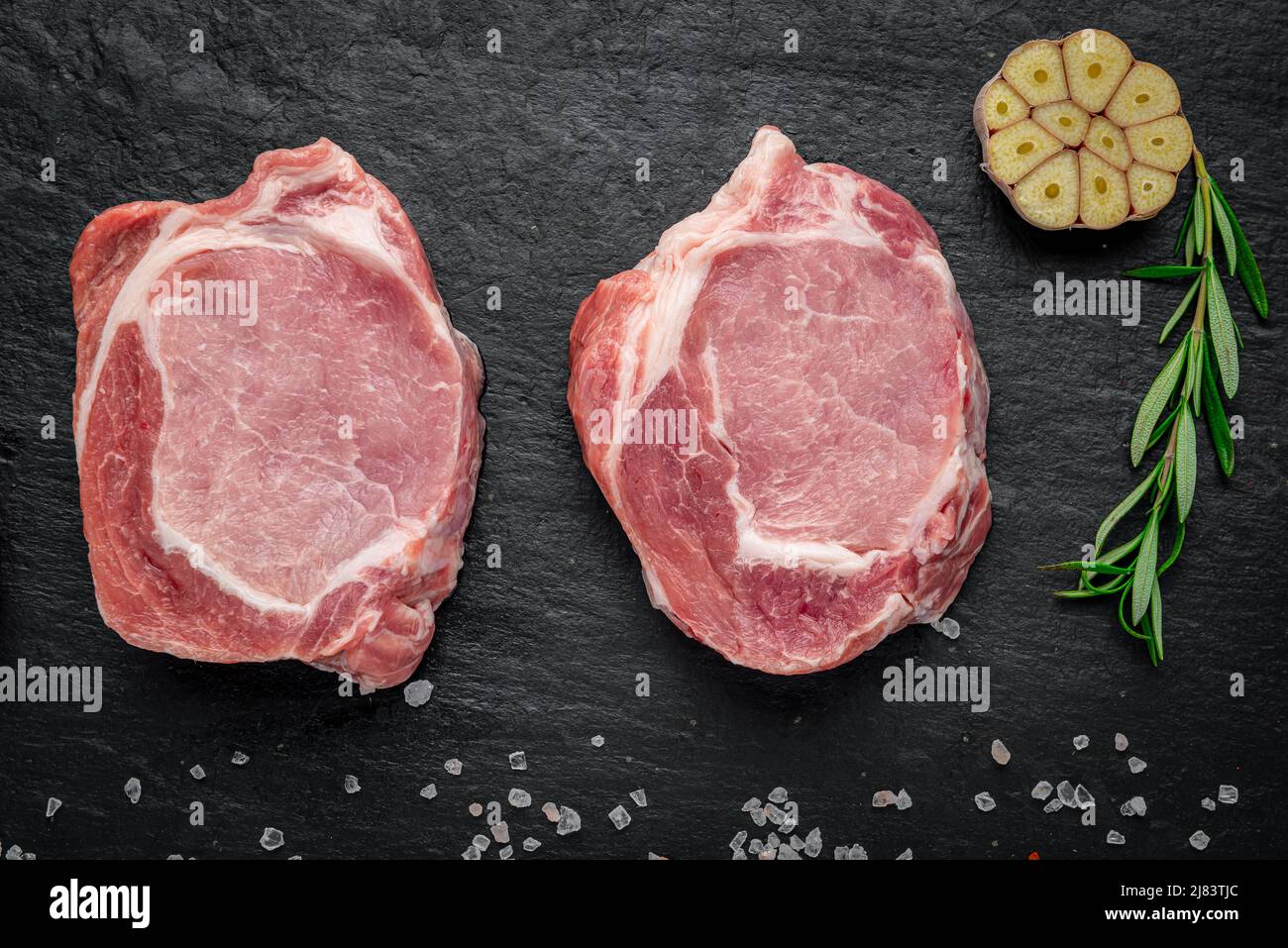 Raw organic meat. Pork steaks, fillets for grilling, baking or frying. Stock Photo
