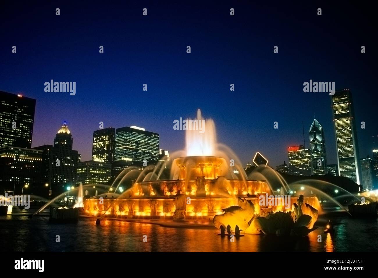 1990s BUCKINGHAM MEMORIAL FOUNTAIN AT DUSK LOCATED IN GRANT PARK