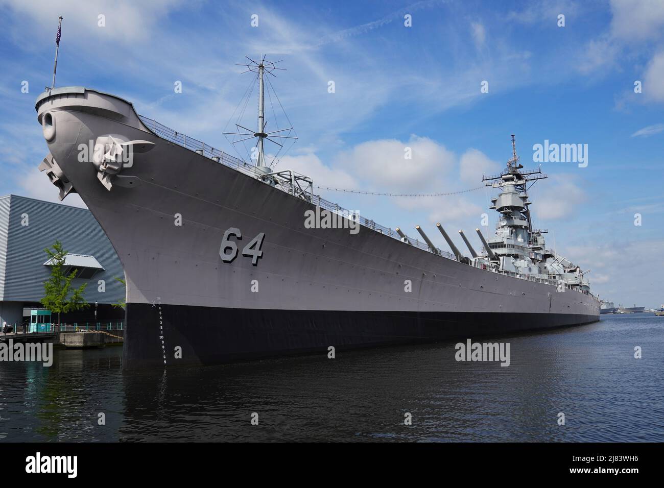 Side-View of the USS Wisconsin (BB-64) at its berthed in Norfolk, VA. The USS Wisconsin is adjacent to Nauticus, The National Maritime Center. Stock Photo