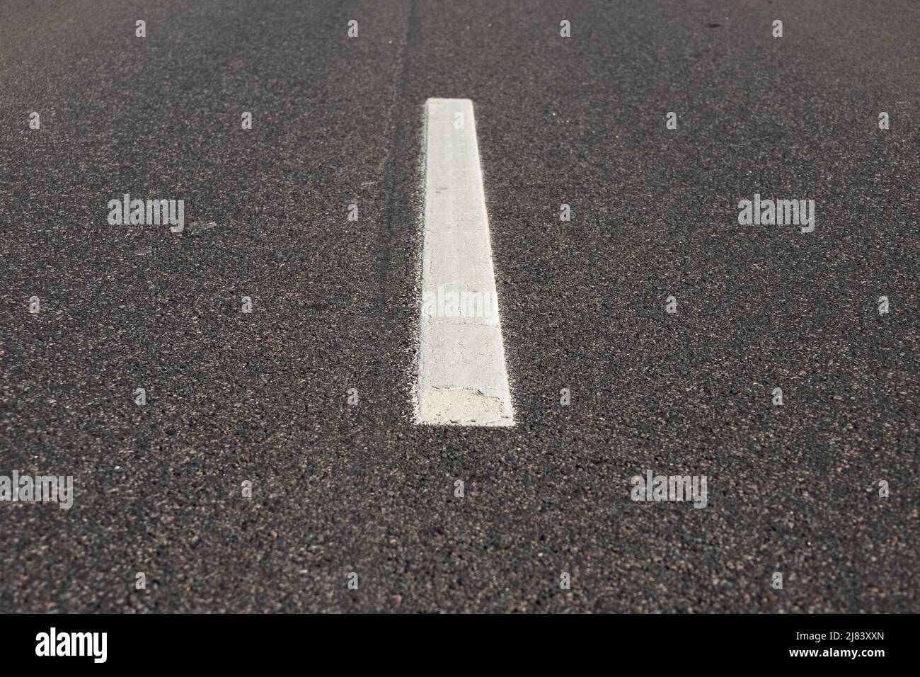 Asphalt road with single solid white line road marking Stock Photo Alamy