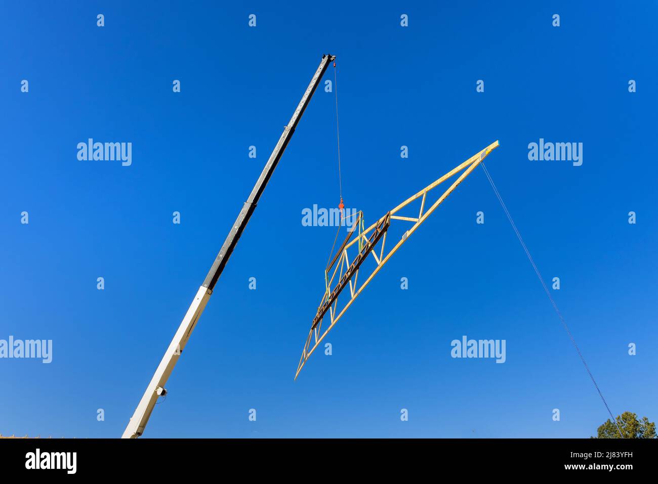 Roof truss system with wooden timber, beams an interior view house building Stock Photo