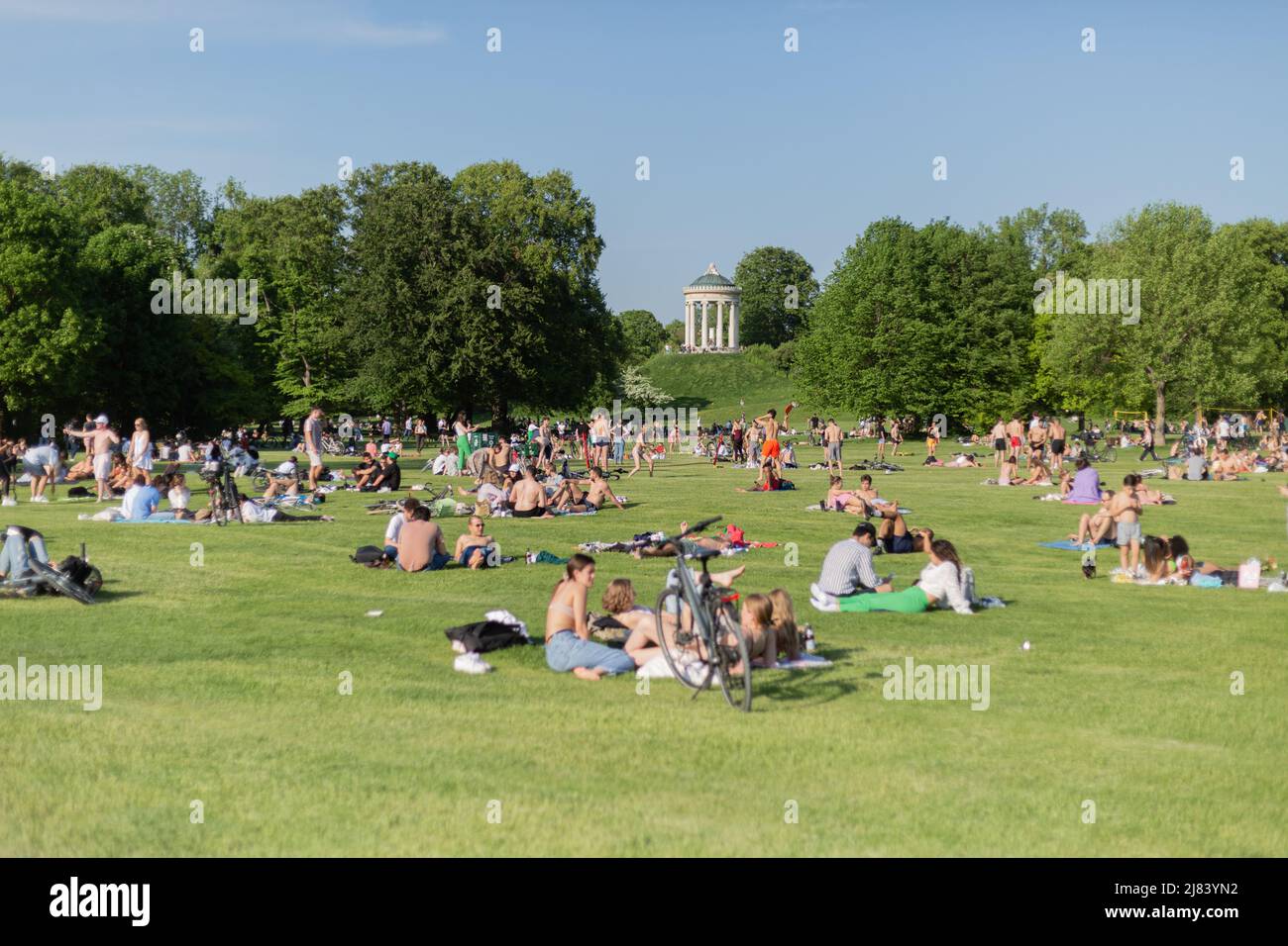 Munich, Germany. 12th May, 2022. On May 12, 2022 many mostly young peole relax in the English Garten in Munich, Germany. A few bathed in the Eisbach/Schabinger Bach. (Photo by Alexander Pohl/Sipa USA) Credit: Sipa USA/Alamy Live News Stock Photo