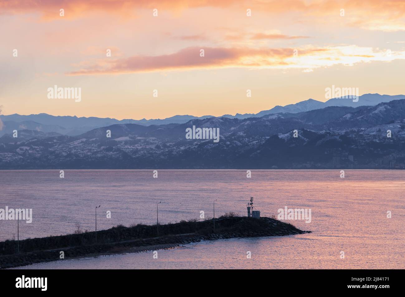 Arakli, Trabzon, Turkey. Coastal view with beacon at the entrance to small Fishing harbor. Black Sea coast in the morning Stock Photo