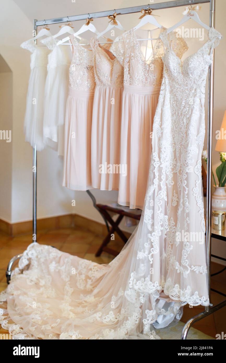 Beautiful white bridesmaid dresses hanging hi-res stock photography and  images - Alamy
