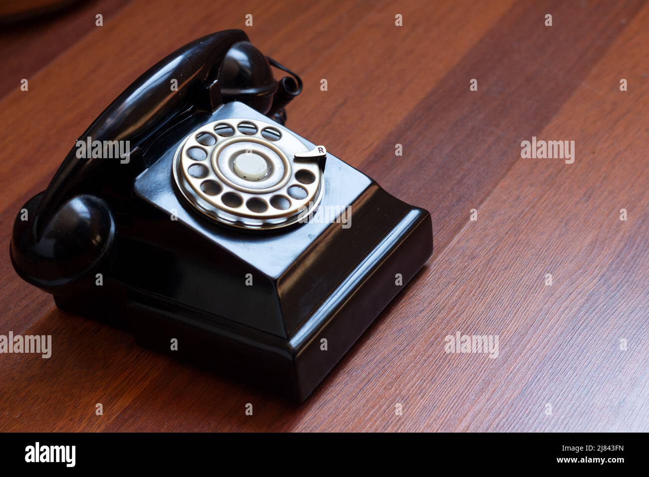classic black analog telephone on wood Stock Photo Alamy