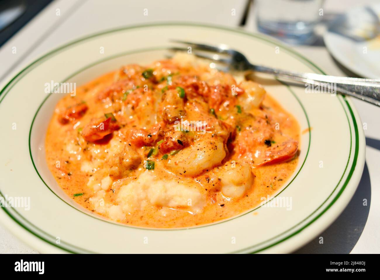 Gulf shrimp and cheddar grits with garlic, chardonnay wine cream sauce