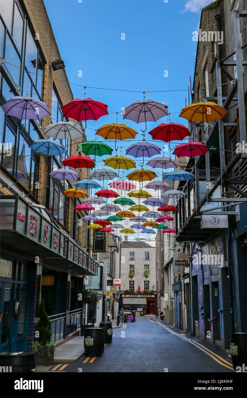 Colorful umbrella parasol display outside Zozimus bar along street in Dublin city centre. Vibrant outdoor art installation. Ireland Stock Photo