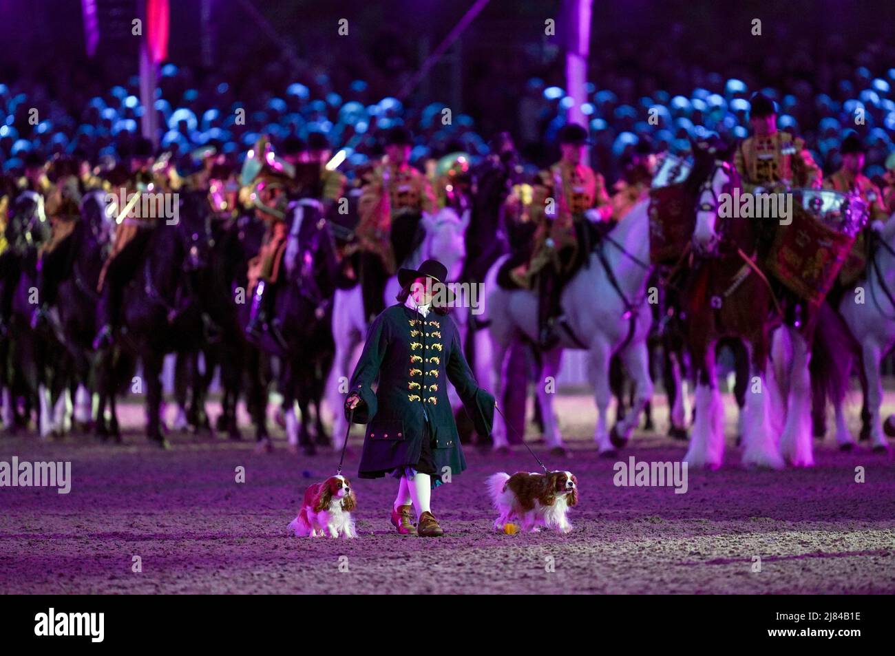 A Performer Parades Two Cavalier King Charles Spaniels Dogs During The A Gallop Through History Platinum Jubilee Celebration At The Royal Windsor Horse Show At Windsor Castle Picture Date Thursday May 12
