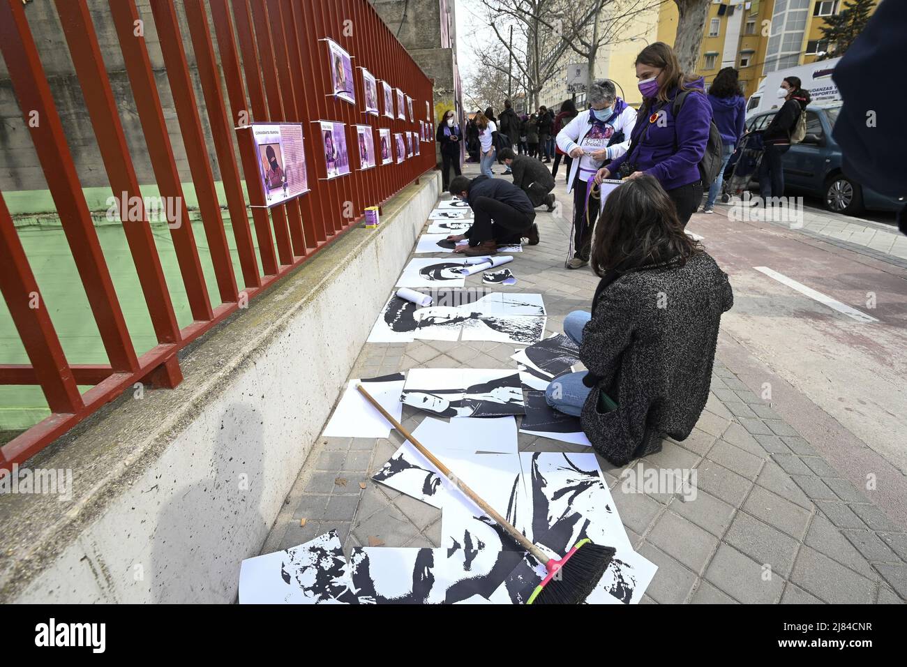 People gather to stage a protest after a feminist mural, depicting icons like Frida Kahlo, Rosa Parks and Nina Simone, vandalized by black spray paint ovenight in Madrid, Spain Featuring: Atmosphere Where: Madrid, Spain When: 08 Mar 2021 Credit: Oscar Gonzalez/WENN Stock Photo
