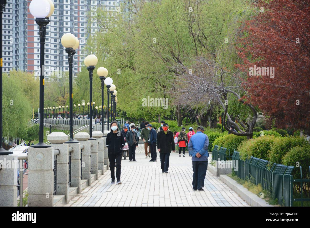 JILIN, CHINA - MAY 12, 2022 - People walk along the Songhua River in Jilin City, Northeast China's Jilin Province, May 12, 2022. Starting from 24:00 o Stock Photo