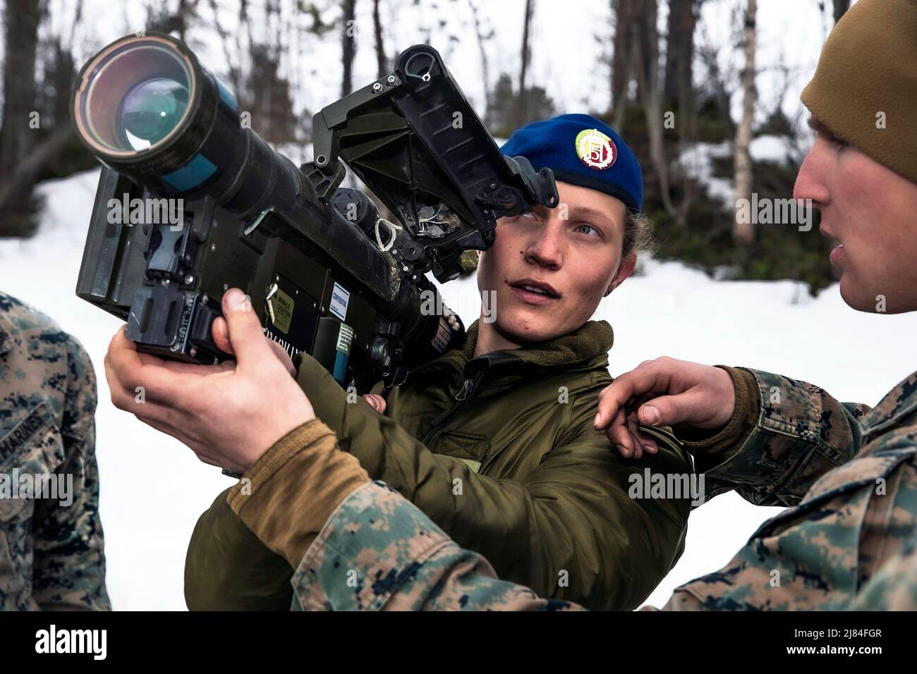 Setermoen, Norway. 25th Apr, 2022. U.S. Marines Corps Lance Cpl. Dylan Pennington, right, assigned to the Aviation Combat Element, 22nd Marine Expeditionary Unit, discusses the functions of the FIM-92 Stinger missile system to Norwegian Army Sgt. Silje Skarsbakk during a bilateral training event in Setermoen, Norway, April 25, 2022. The 22nd MEU, embarked aboard the Kearsarge Amphibious Ready Group, is participating in a bilateral training event with the Kingdom of Norway's Armed Forces to strengthen U.S. and Norway interoperability, ensuring collective capabilities and steadfast partnership Stock Photo