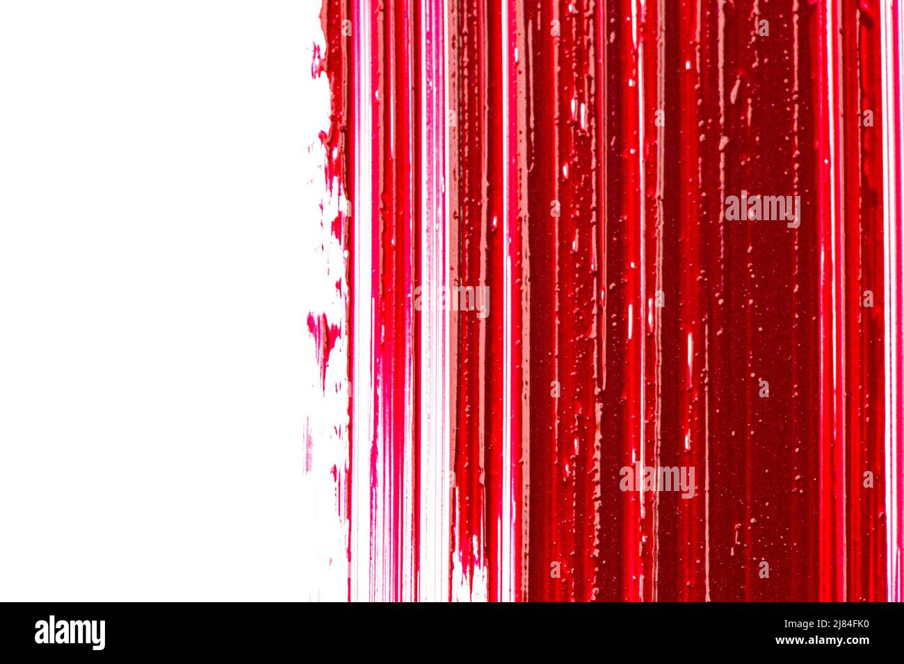 Lipstick texture on a white background. red lipstick surface. lipstick background.Makeup and cosmetics product Stock Photo