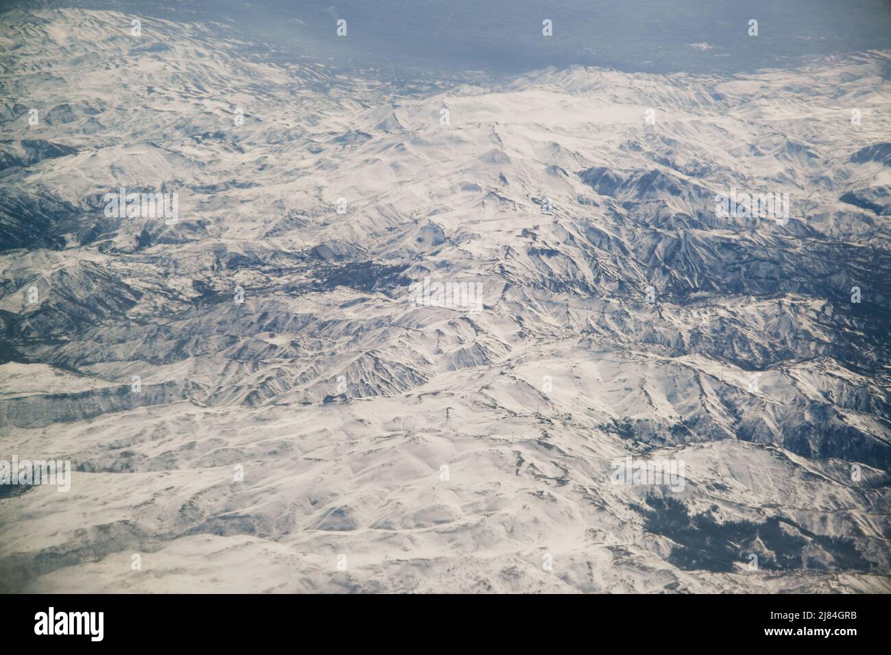 Aerial view of snowy mountains hi-res stock photography and images - Alamy