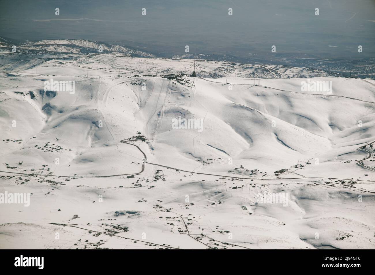 Aerial view of snowy mountains from a plane window Stock Photo - Alamy