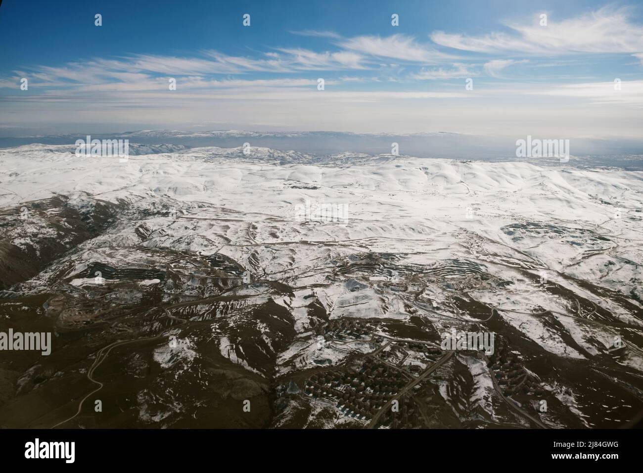 Aerial view of snowy mountains with clouds Stock Photo - Alamy