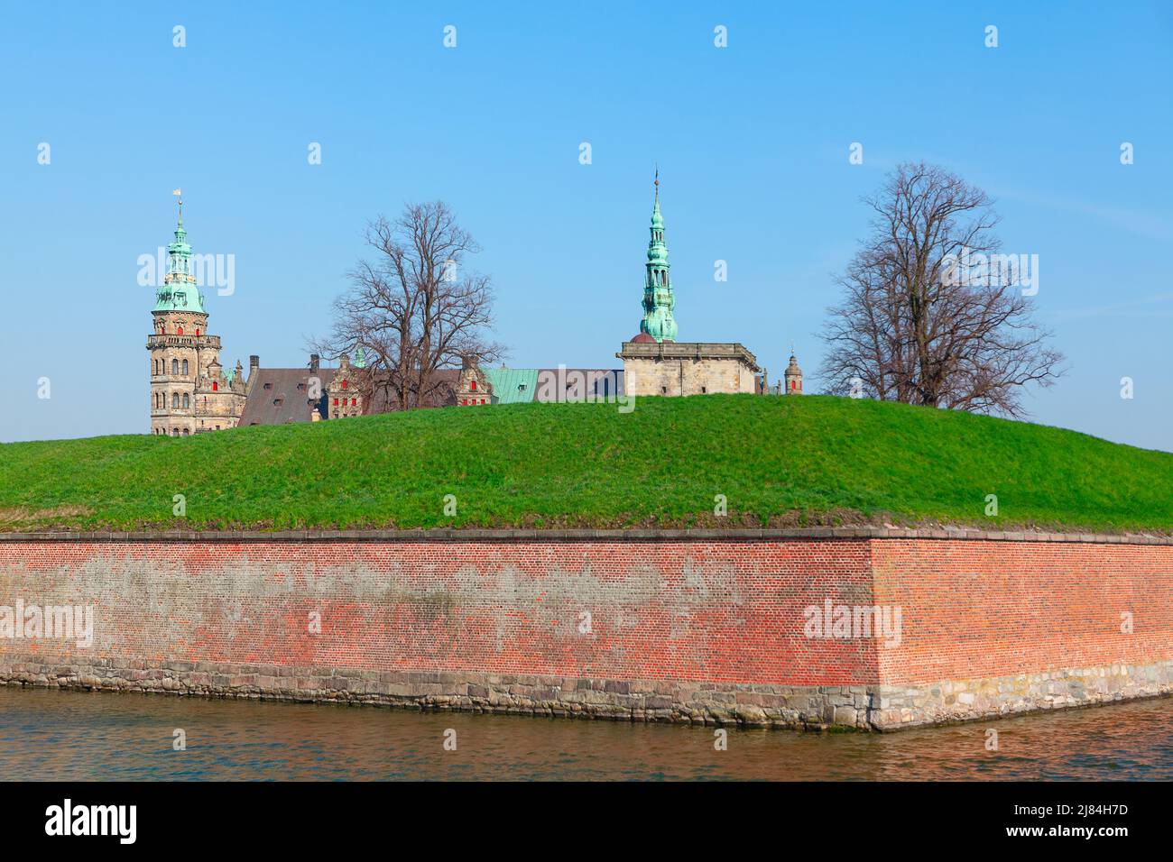 Castle surrounded by water canal . Kronborg Slot with fortification in Helsingor, Denmark Stock Photo