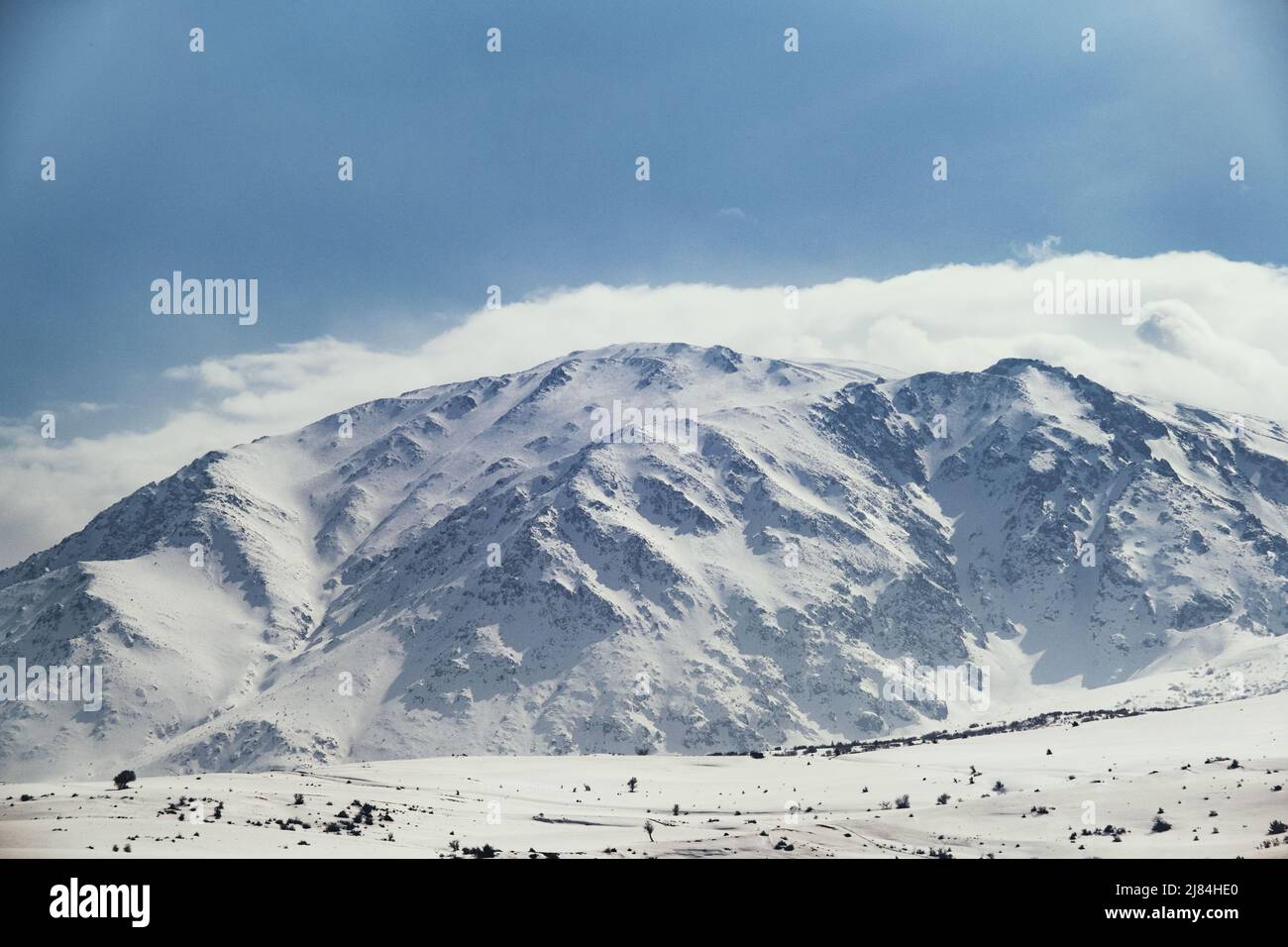 Landscape of a mountain with snow and clouds Stock Photo - Alamy