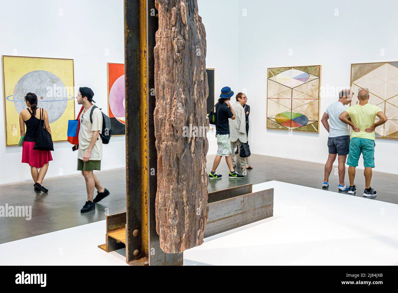New York City NYC Lower Manhattan,Bowery,New Museum,contemporary art,exhibit The Keeper gallery,Hilma af Klint driftwood sculpture visitors men women Stock Photo