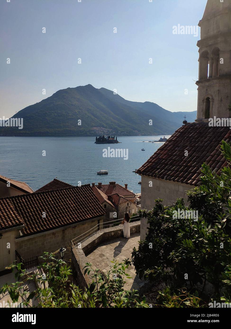 View from above on houses roofs, the sea with mountains in old town Perast, Montenegro Stock