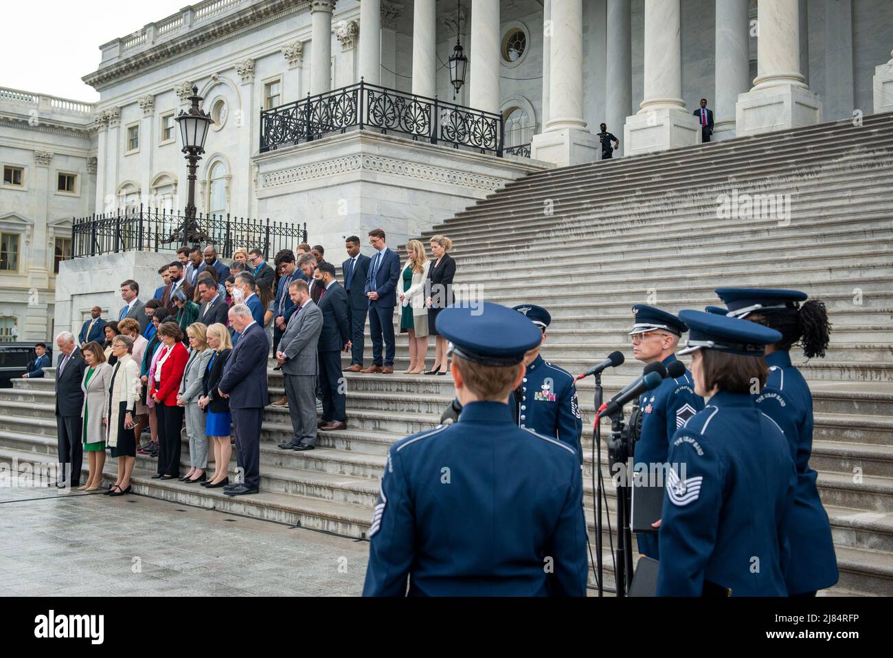 While the United States Air Force Band sings, a fraction of the Democratic members of the House of Representatives hold a Moment of Silence for the One Million American Lives Lost to COVID-19, on the East Front Center Steps at the US Capitol in Washington, DC, Thursday, May 12, 2022. Credit: Rod Lamkey/CNP /MediaPunch Stock Photo