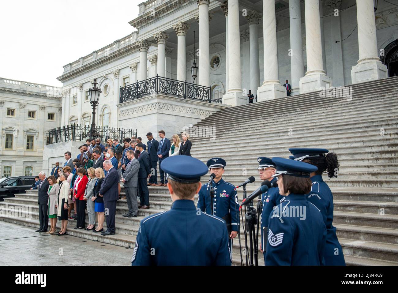 While the United States Air Force Band sings, a fraction of the Democratic members of the House of Representatives hold a Moment of Silence for the One Million American Lives Lost to COVID-19, on the East Front Center Steps at the US Capitol in Washington, DC, Thursday, May 12, 2022. Credit: Rod Lamkey/CNP /MediaPunch Stock Photo